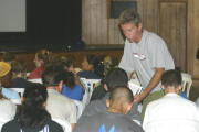 Coach Shaklee helps a group in training class