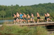 Group on lake bridge