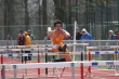 Chris Chen on his way to 1st place in Shuttle Hurdles Relay